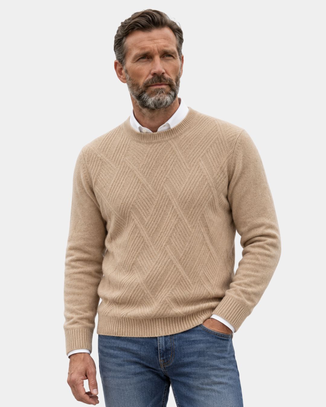 Beige wool crewneck sweater with a raised diamond knit pattern, ribbed trim, and relaxed fit worn over a white shirt.
