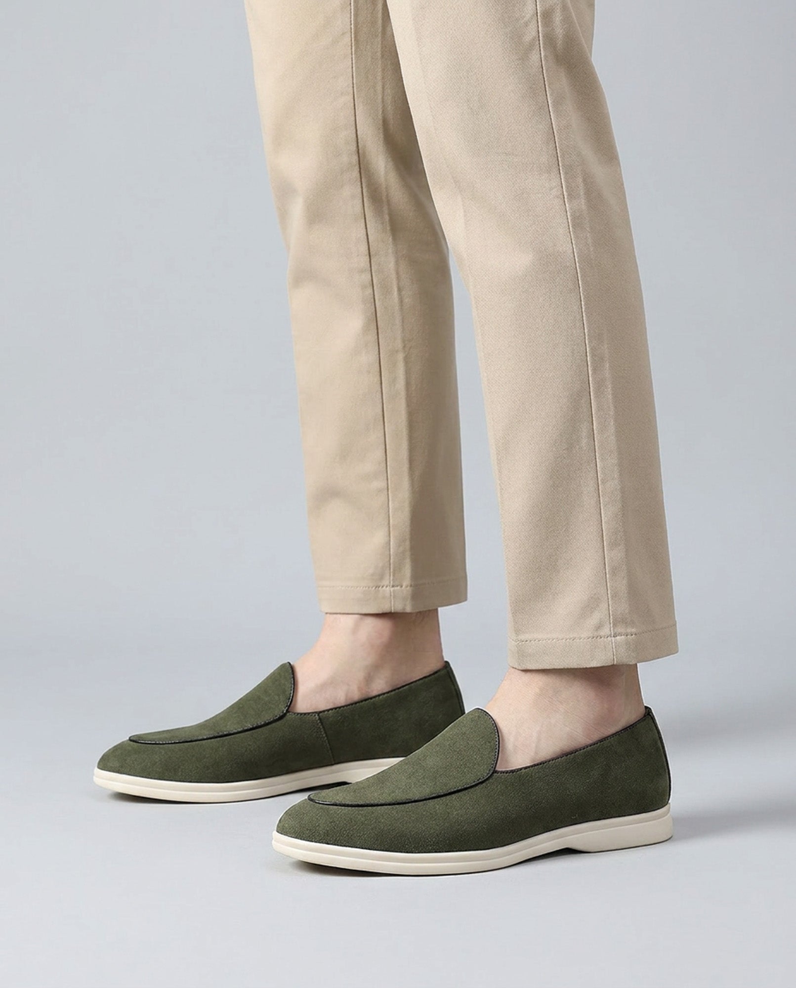 Milan men's olive suede slip-on loafers worn with beige trousers
