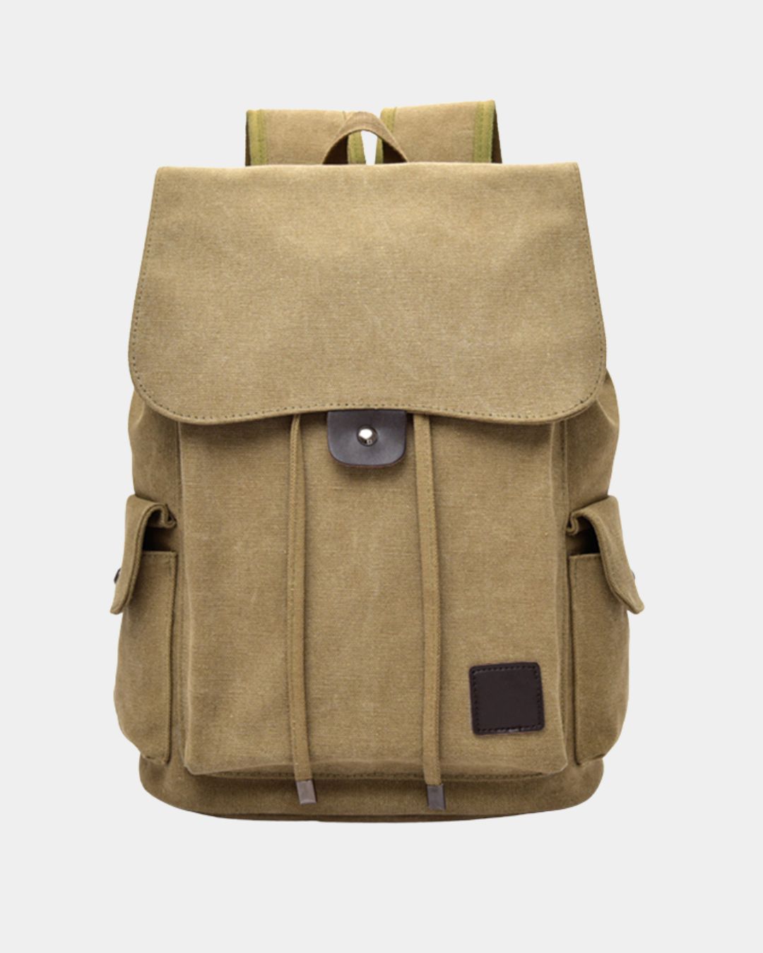 A beige canvas backpack with a large front flap, side pockets, drawstring details, and a dark brown leather patch on the lower right, by Hudson & Tate.
