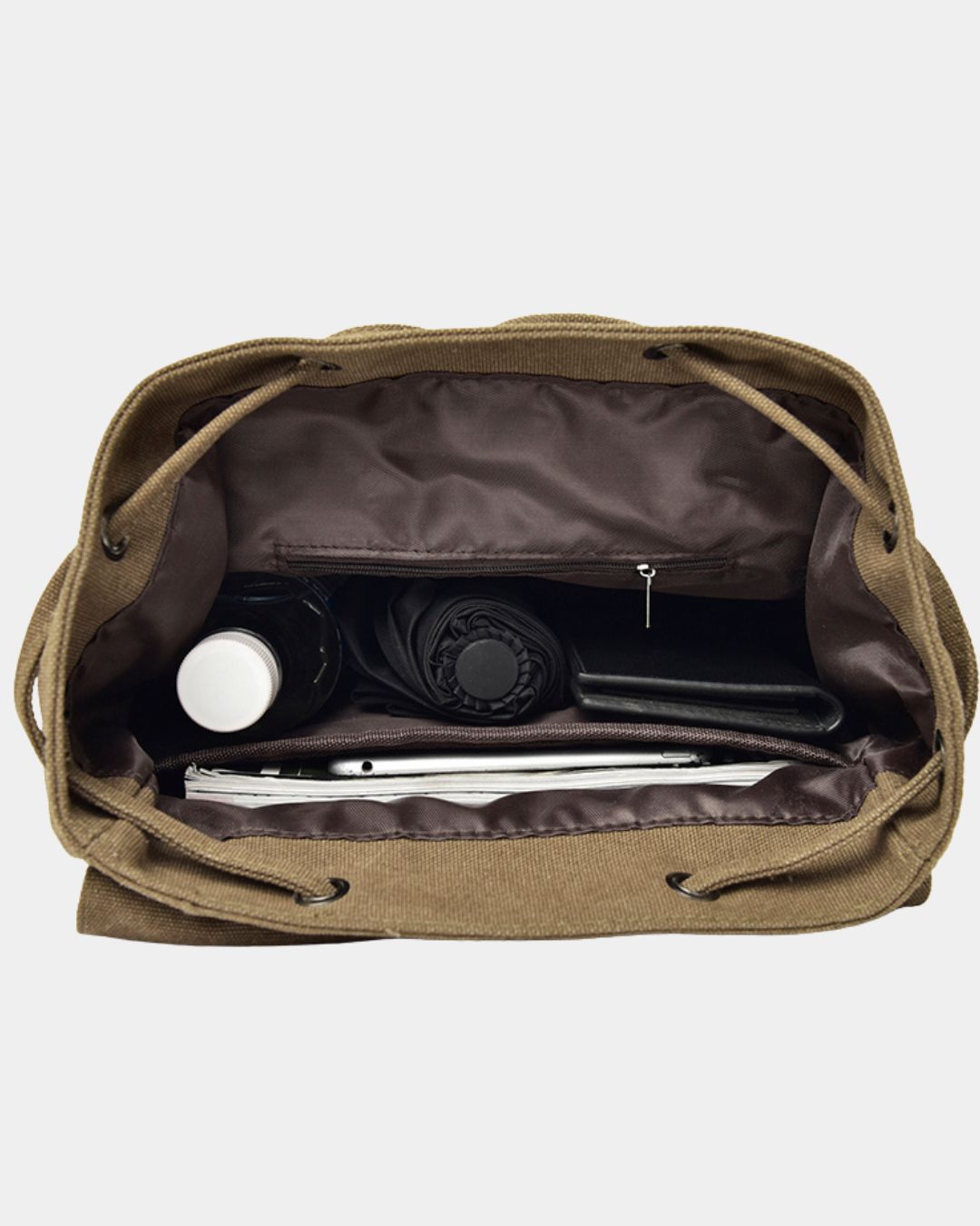 An open khaki canvas drawstring bag shown from above, revealing a dark brown interior organizer with a zipper pocket, a bottle, a rolled item, and a slim accessory.