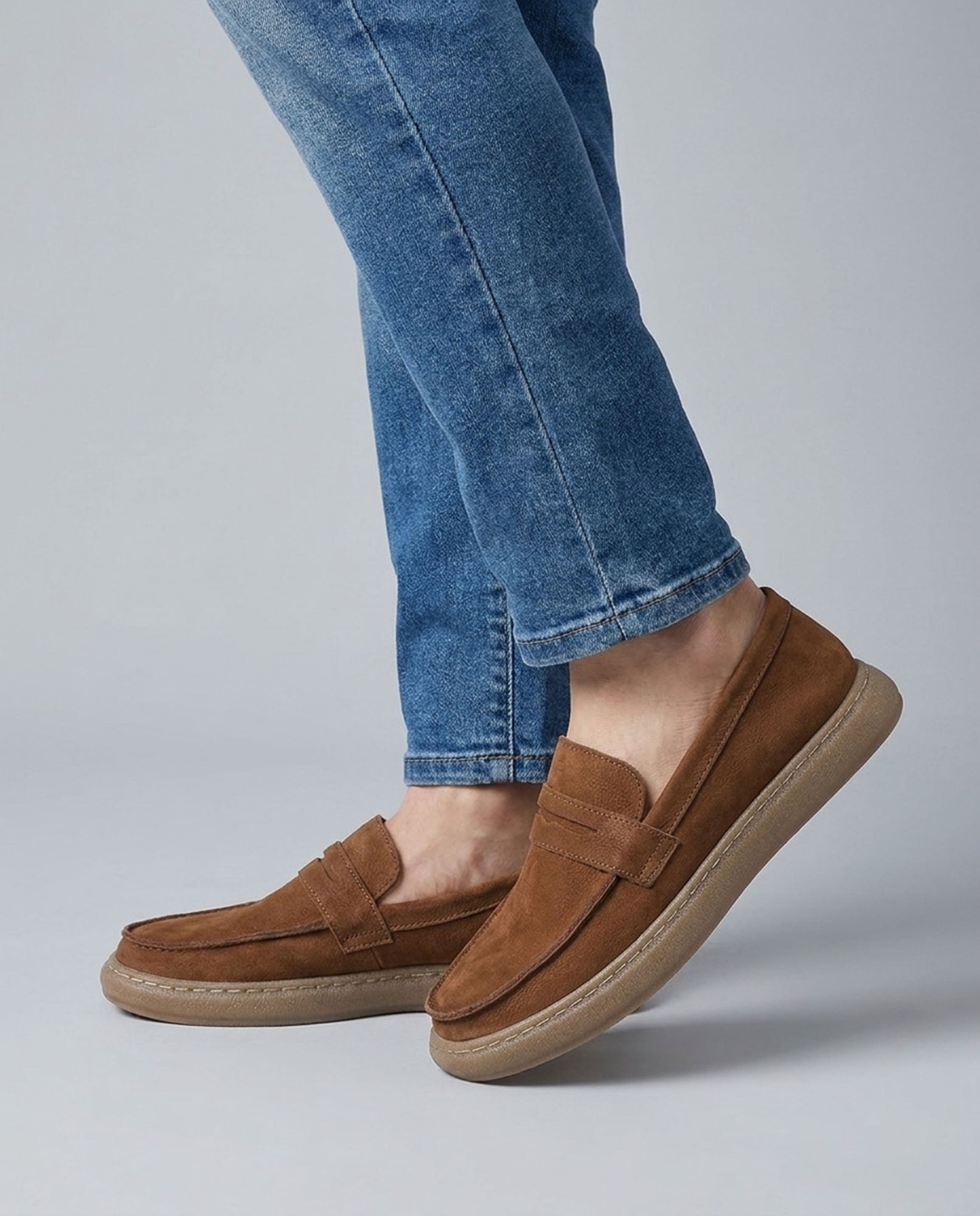 Salcombe men's brown leather penny loafers styled with blue denim jeans