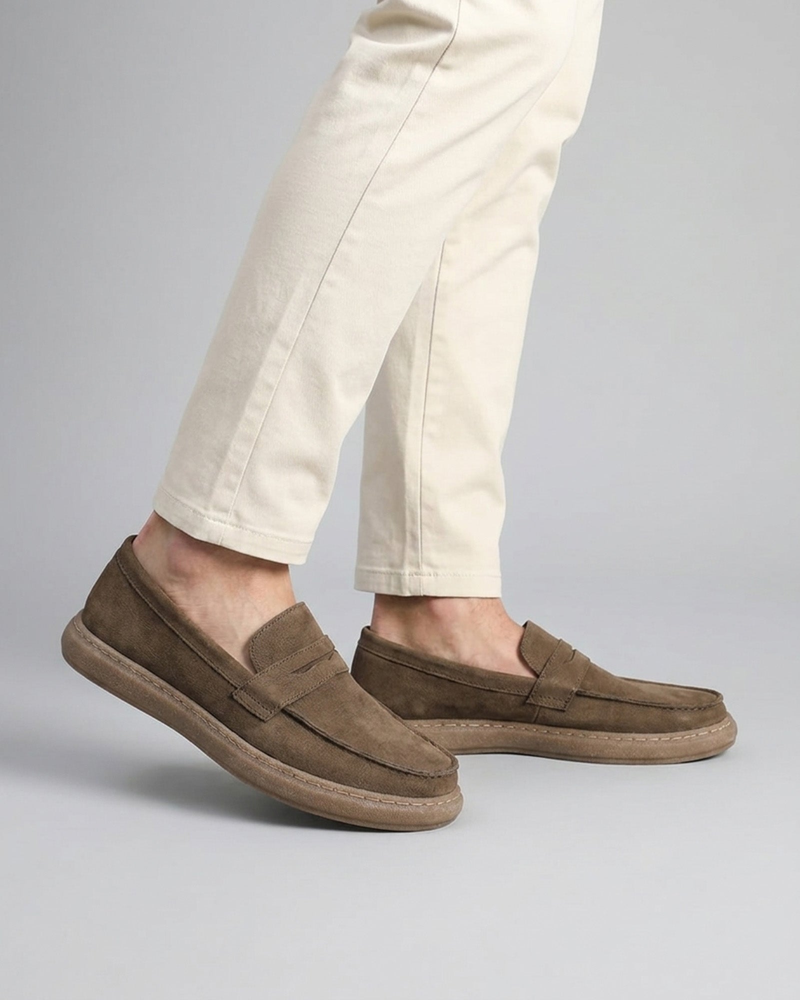 Salcombe men's dark grey leather penny loafers styled with cream chinos