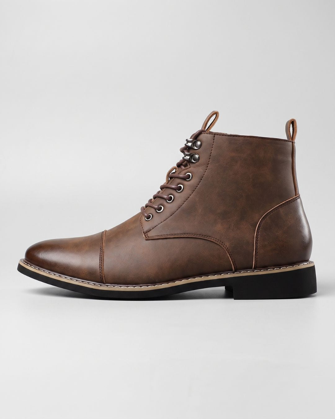 Brown cap-toe men's ankle boots with lace-up front, metal eyelets, and a durable rubber outsole.