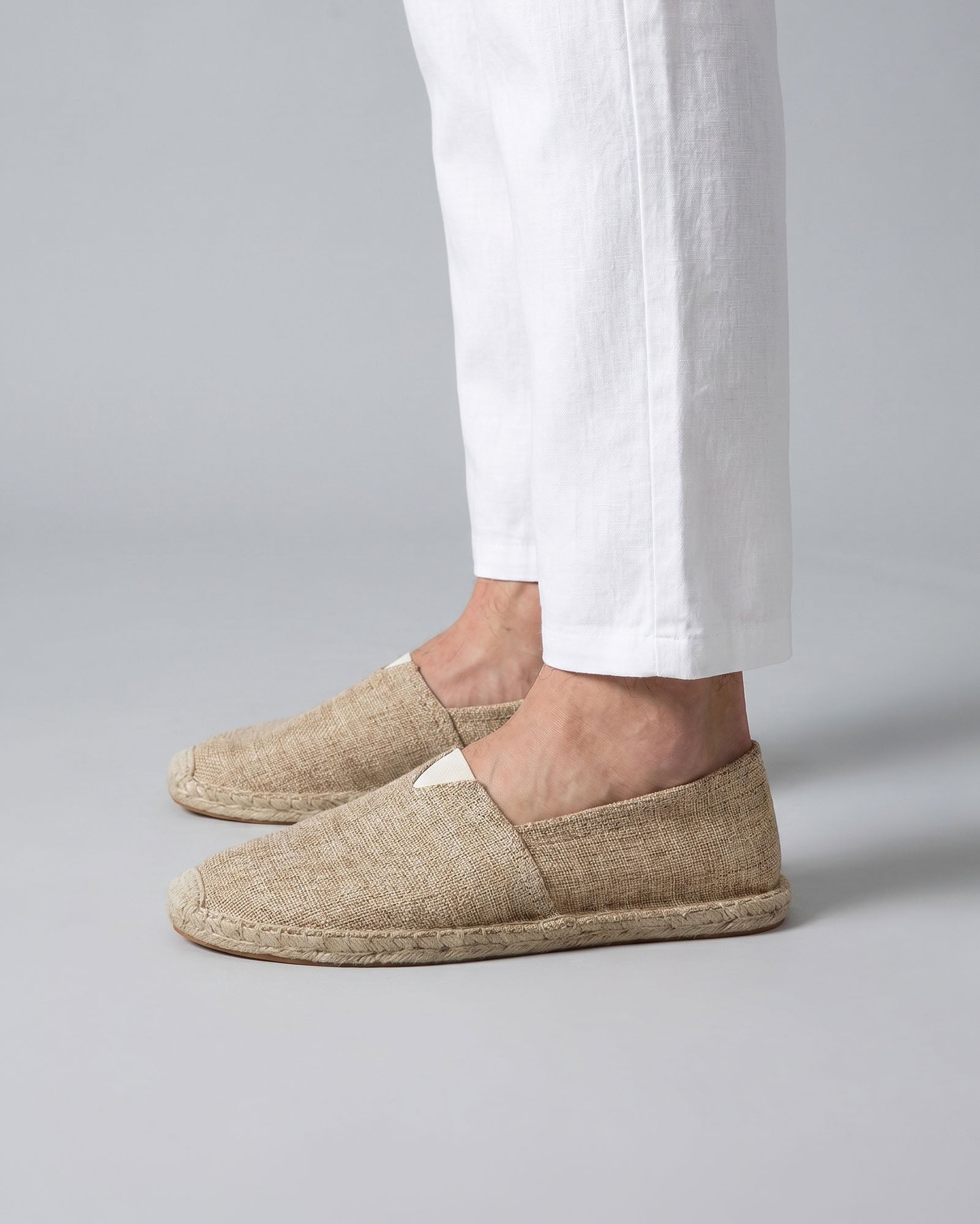 Tulum men's beige canvas espadrille loafers worn with white trousers