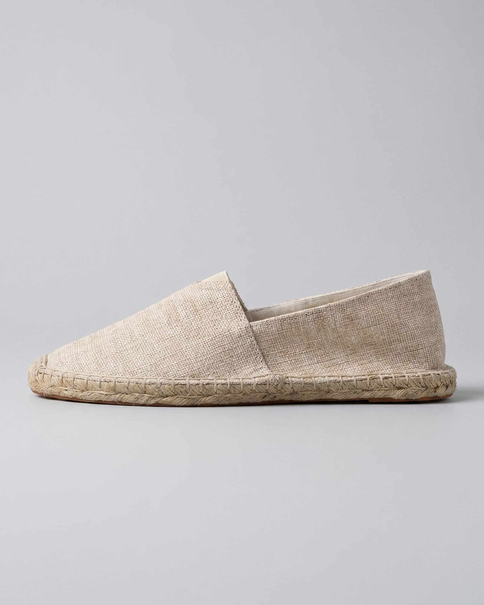 Side view of Tulum men's sand canvas espadrille loafer with woven jute sole