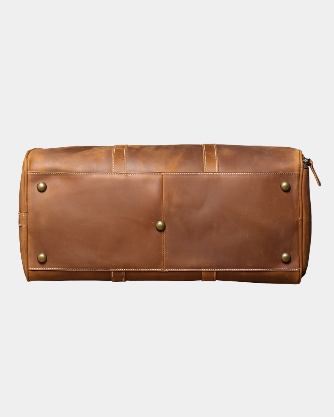 Bottom view Men's brown crazy horse leather duffel bag with luggage tag and crossbody strap by Hudson & Tate.