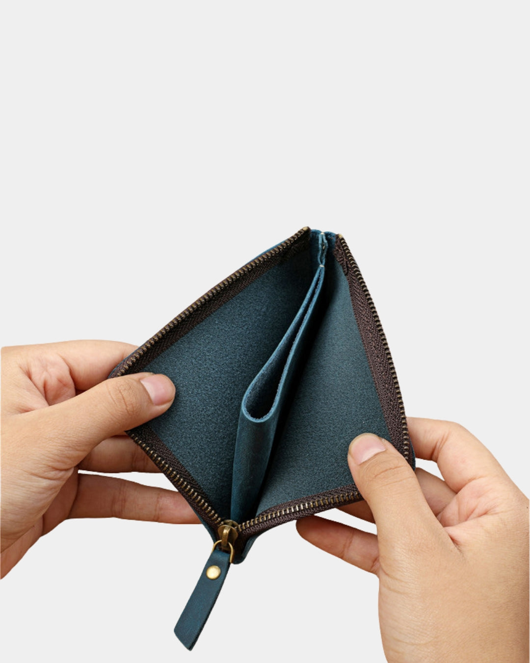 Hands holding a blue genuine cowhide leather wallet with a secure zip-around closure and central coin slip pocket.