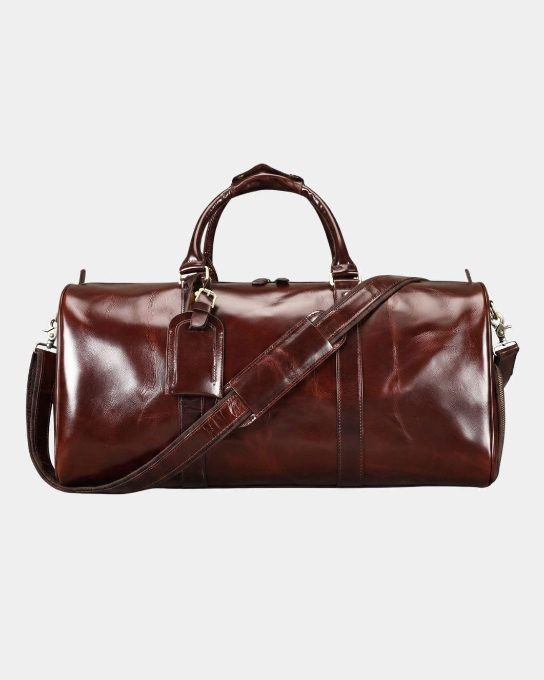 Detail of men's leather weekender duffel bag luggage tag and zip closure