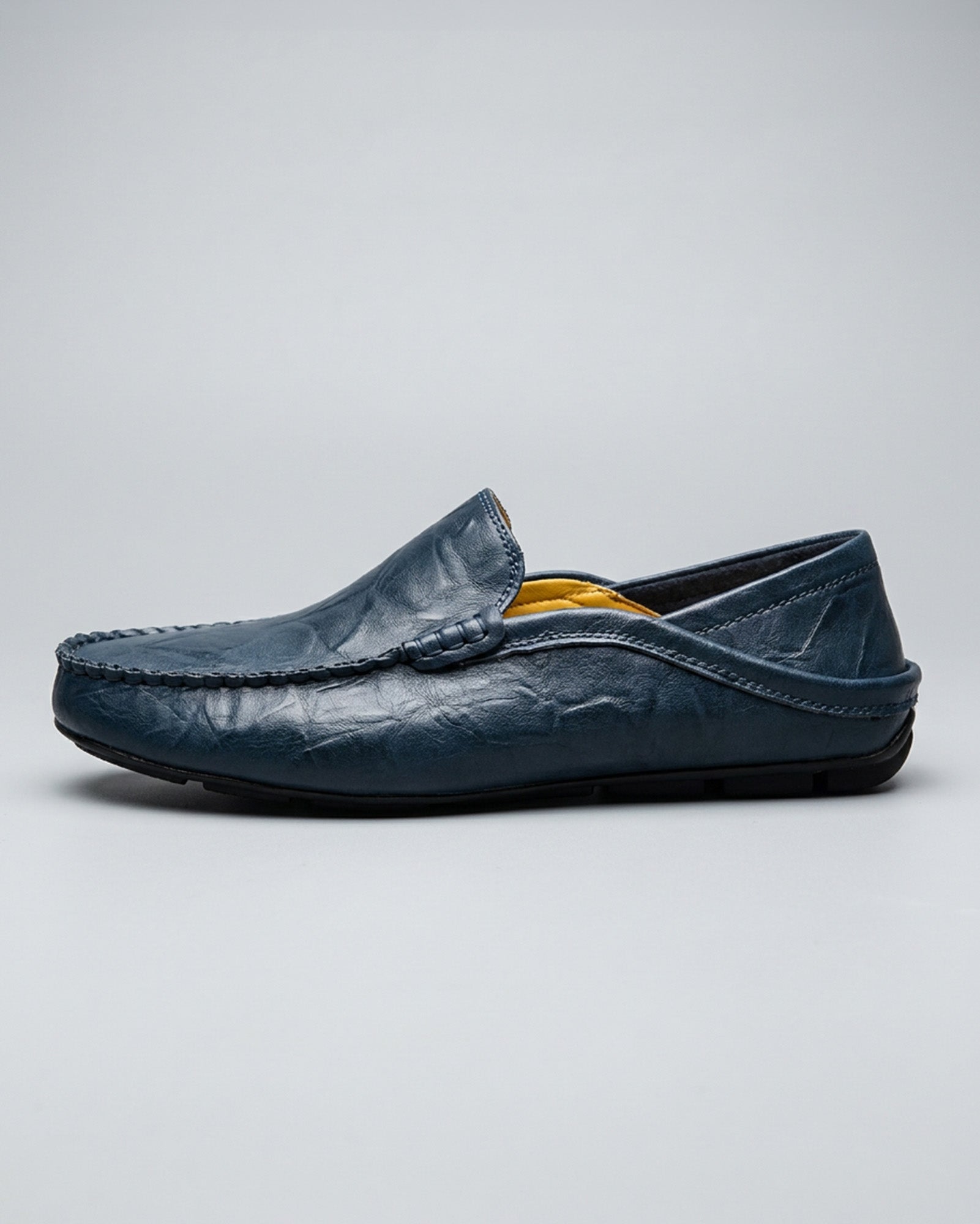 Side view of Beckett men's navy leather driving loafer