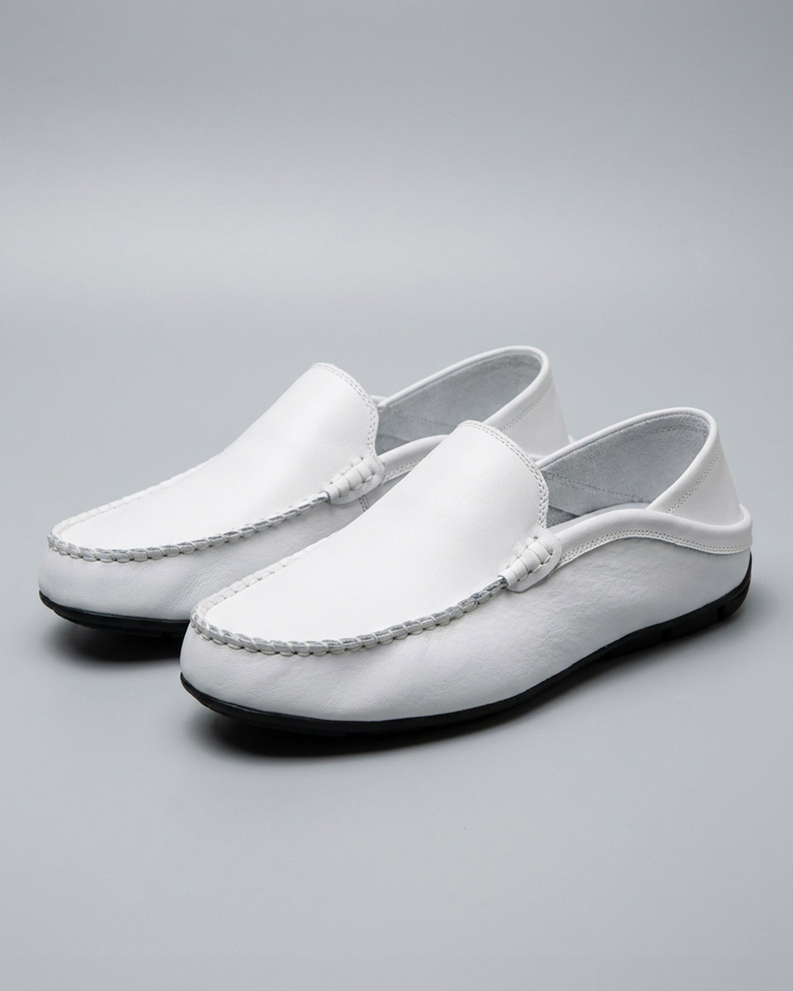 Pair of Beckett men's white leather driving loafers