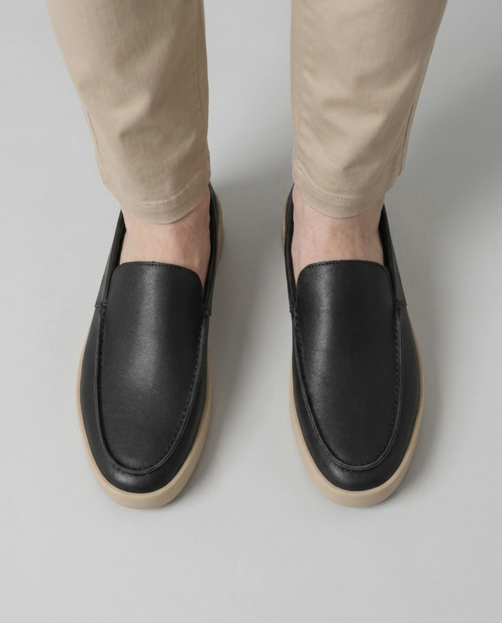 Overhead view of Boston men's black slip-on loafers with minimalist plain-vamp design