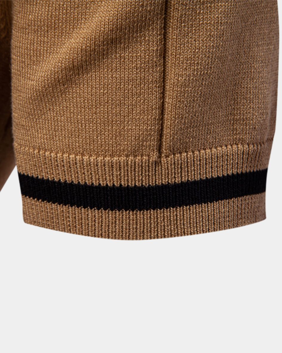 Close-up of a camel sweater with a black stripe on a white background