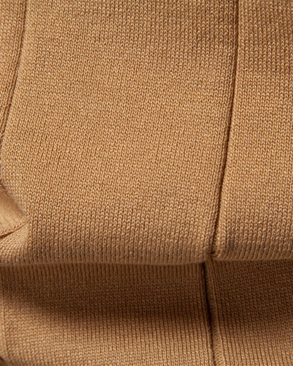 Close-up of camel fabric with a textured pattern