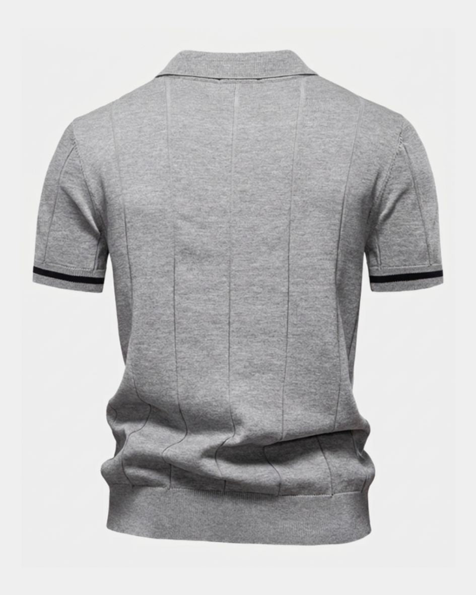 Light gray polo shirt with black trim on a white background