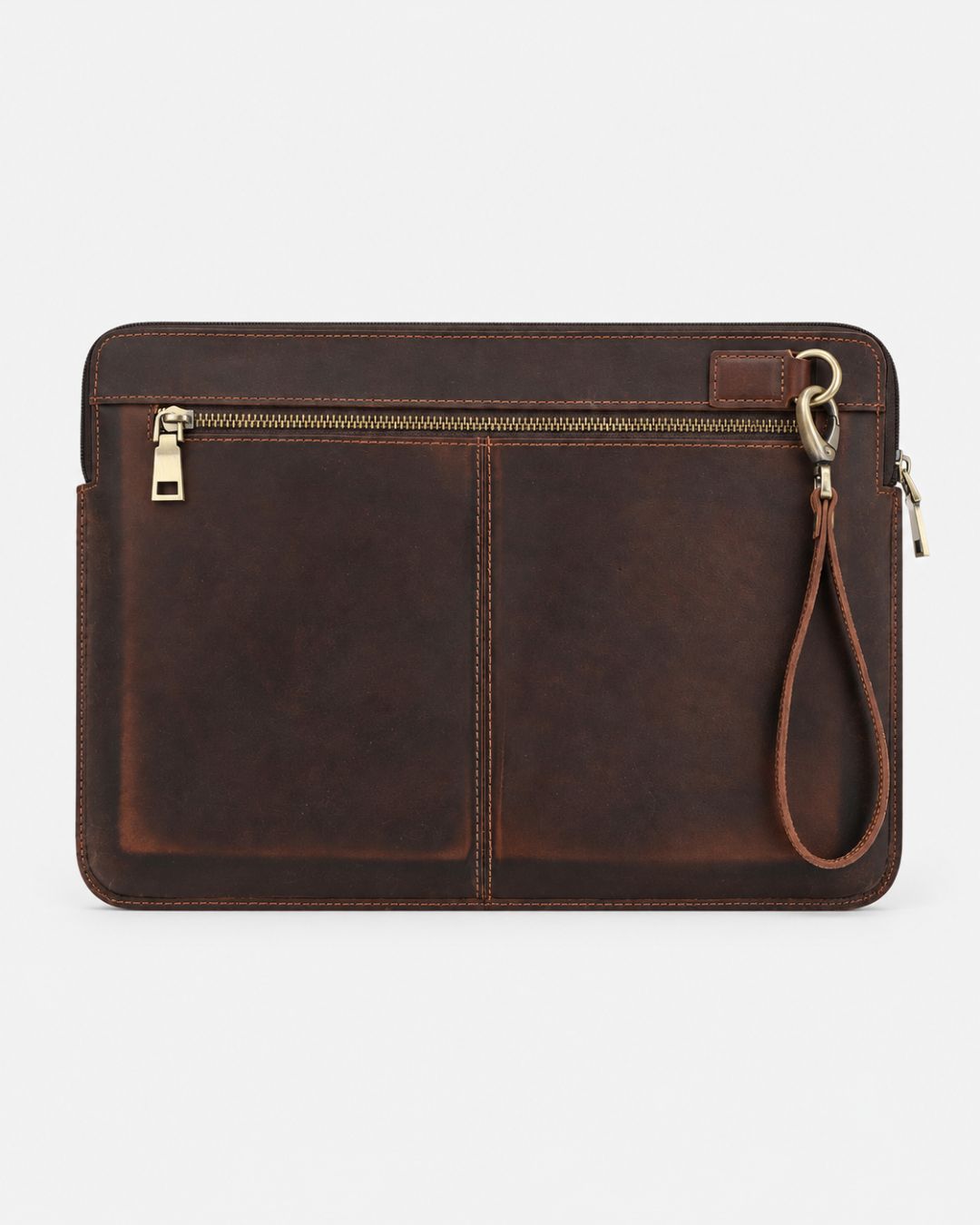 Distressed brown Crazy Horse leather laptop sleeve for 14-inch MacBook with a front zip pocket and detachable wrist strap.