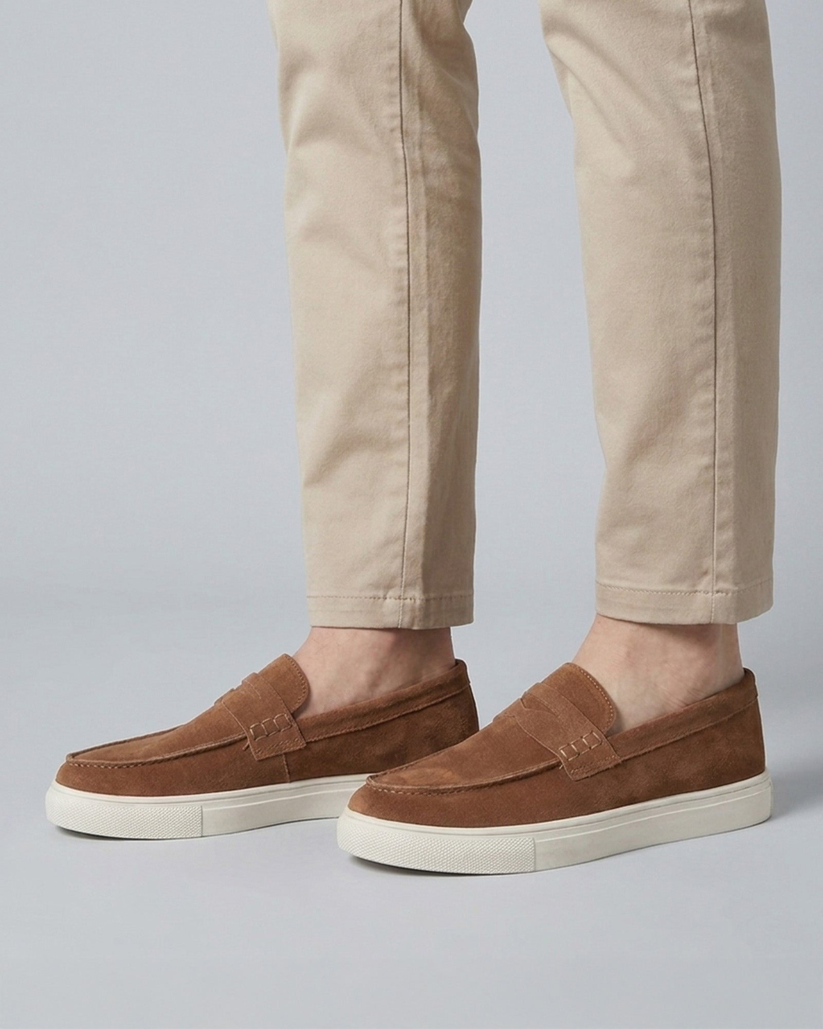 Dunley men's camel penny loafers worn with beige chinos