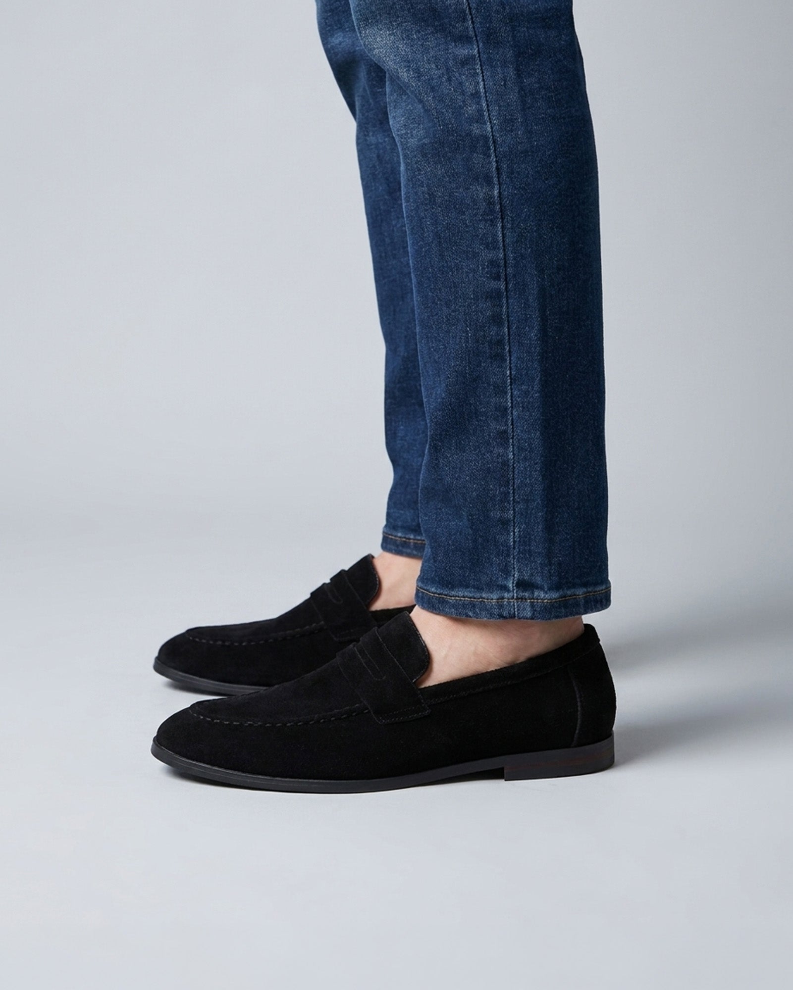 Harper men's black suede penny loafers styled with blue denim jeans