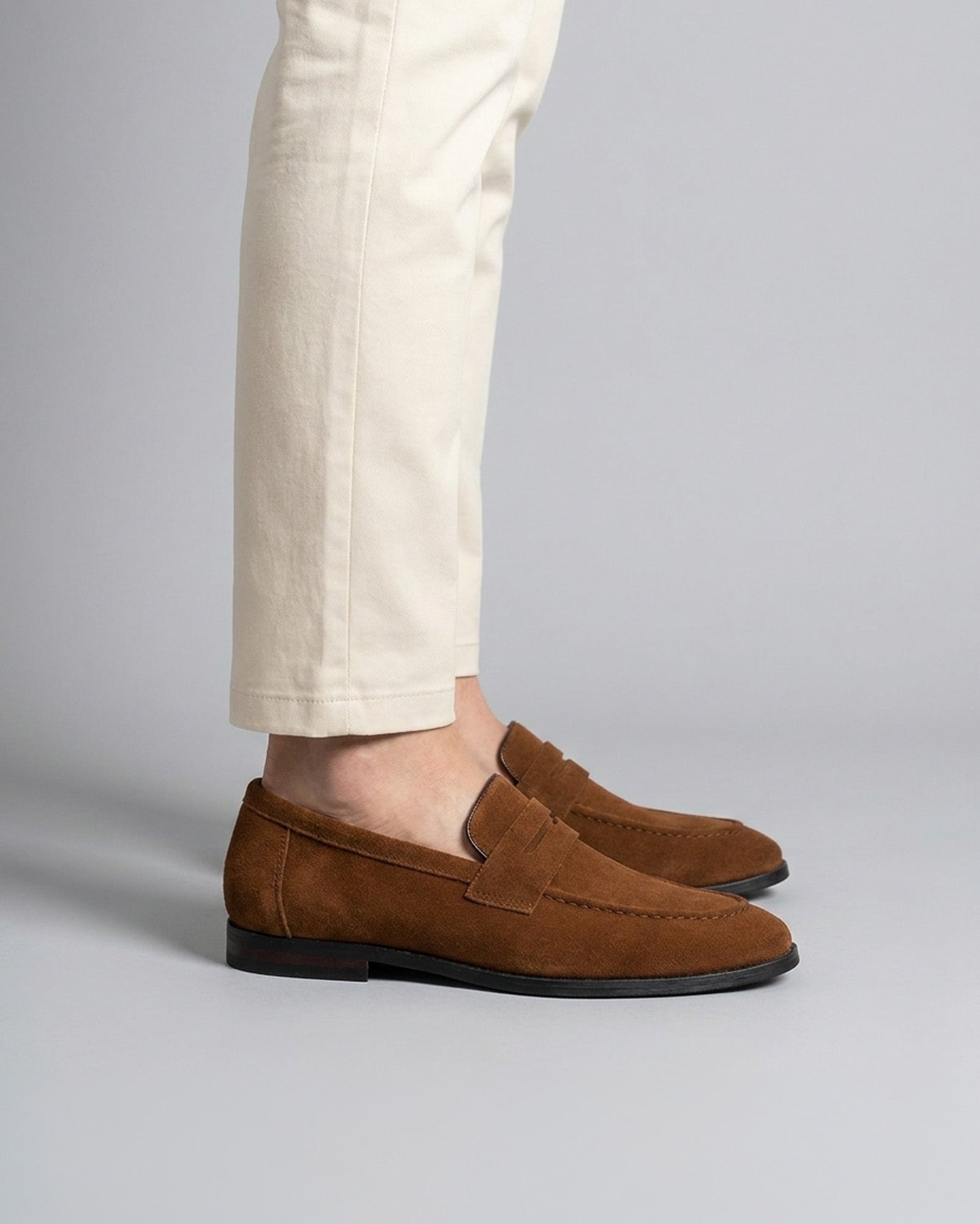 Harper men's cognac suede penny loafers styled with cream chino trousers