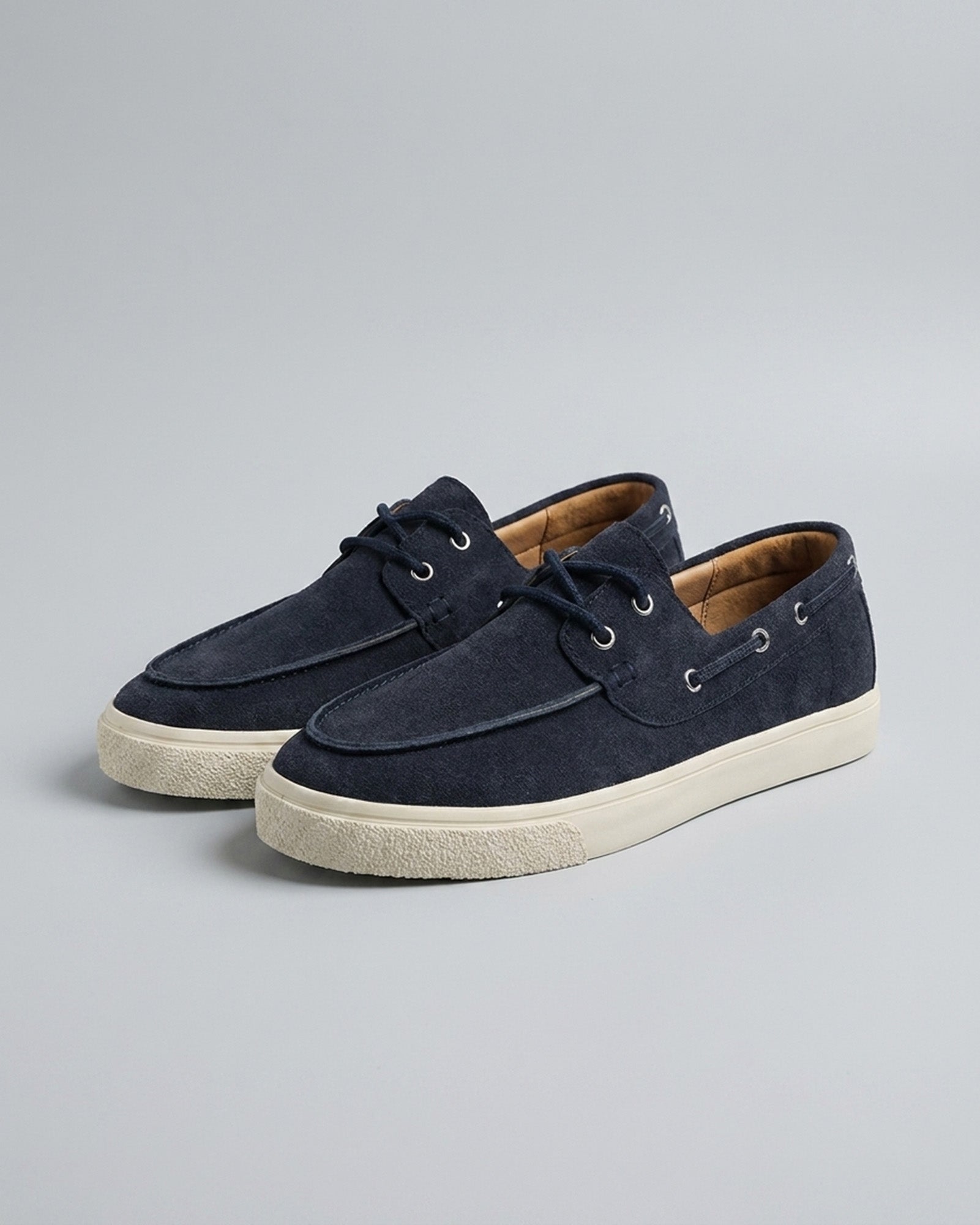 Pair of Harwich men's suede boat shoe sneakers in navy with cream cupsole
