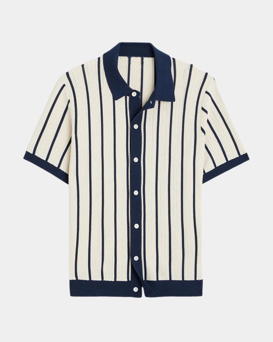 Striped shirt with navy accents on a light gray background