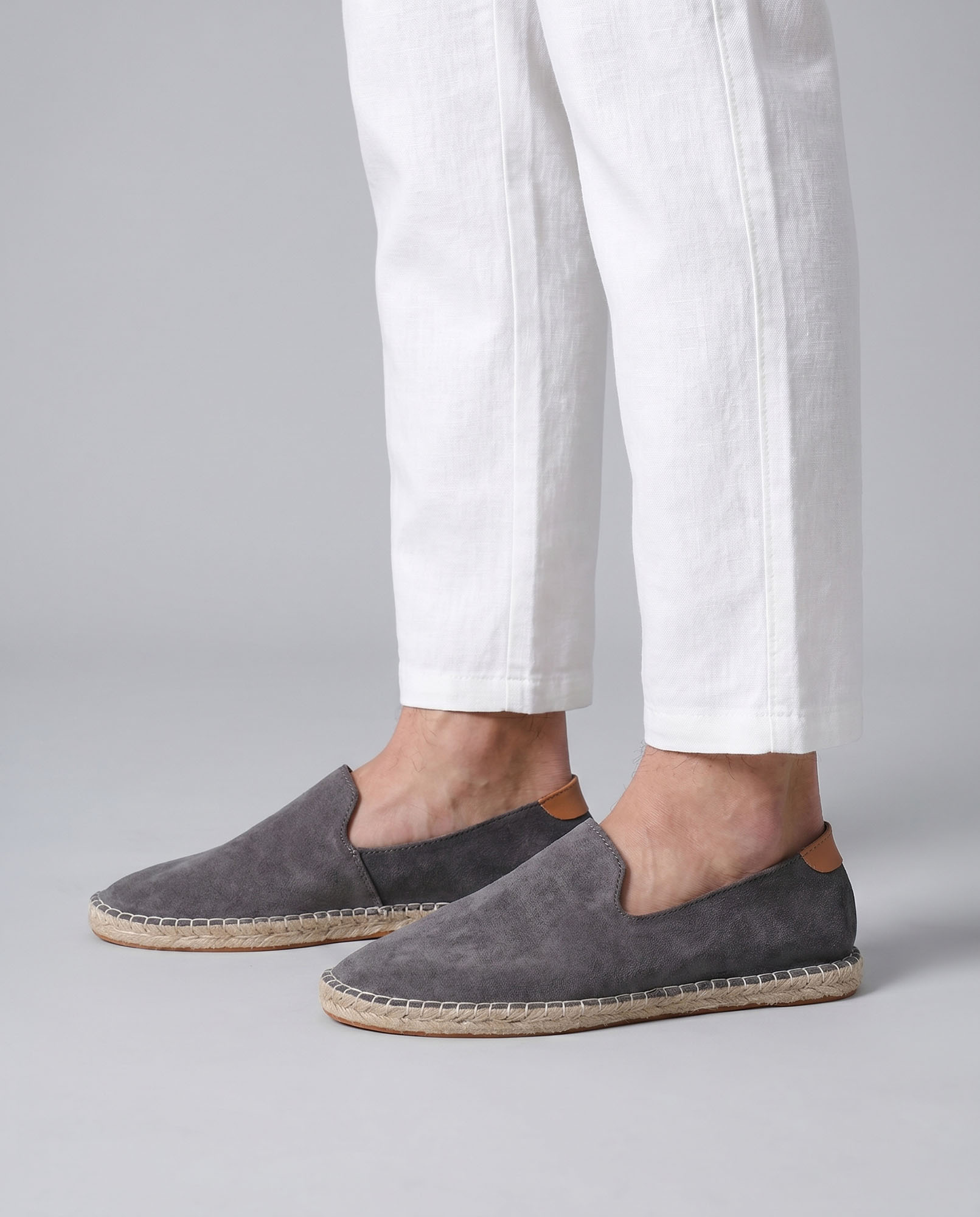 Malaga men's gray suede espadrille loafers worn with white linen trousers