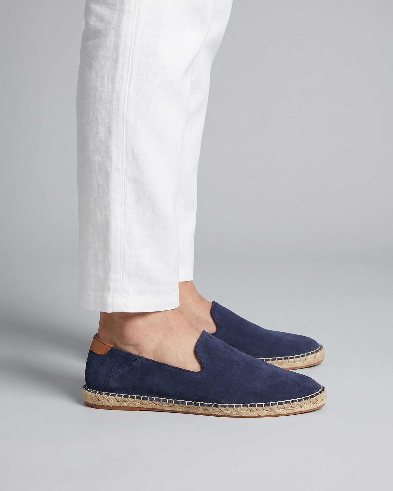 Malaga men's navy suede espadrille loafers worn with white linen trousers