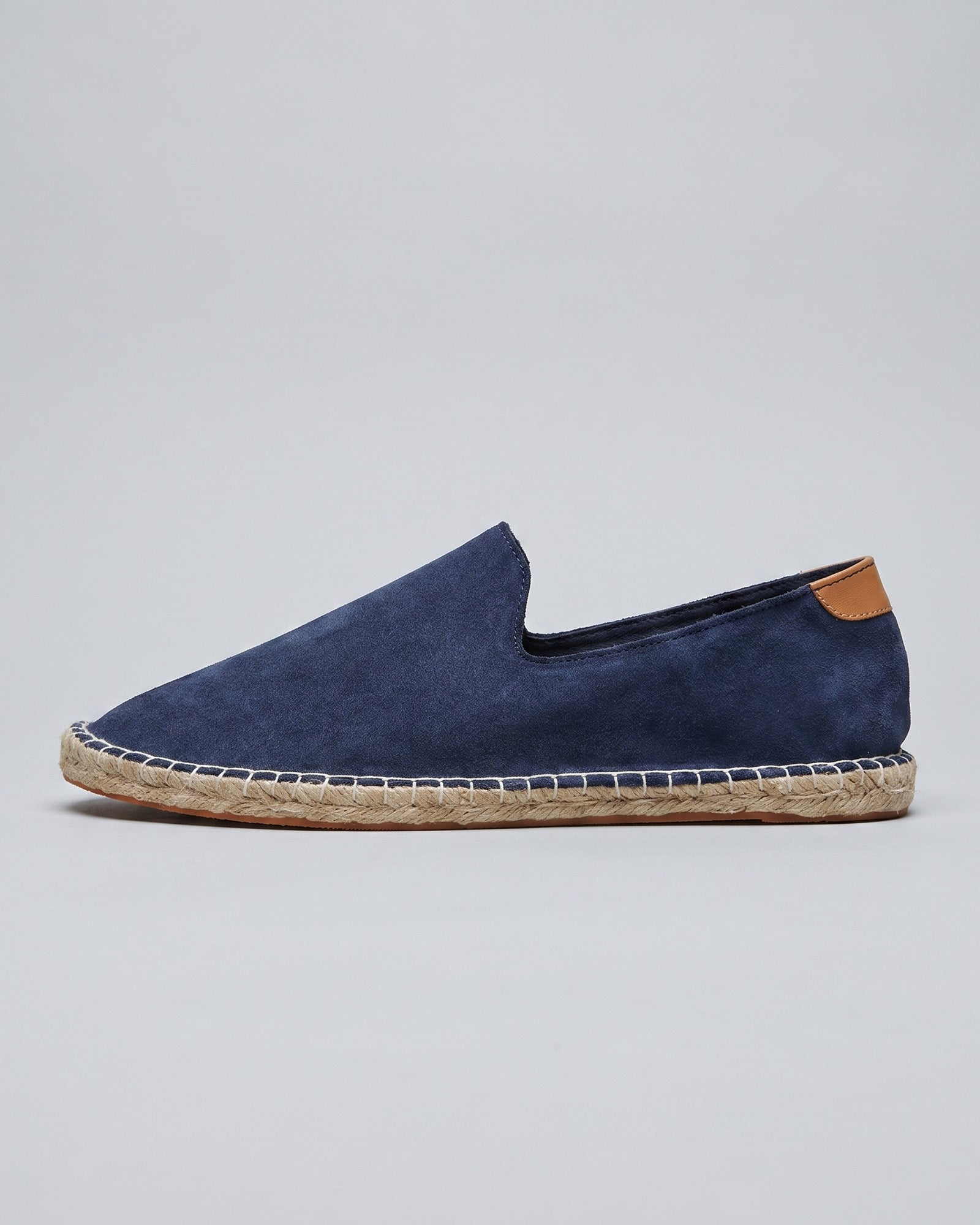 Side view of Malaga men's navy suede espadrille loafers with tan heel counter and jute rope sole