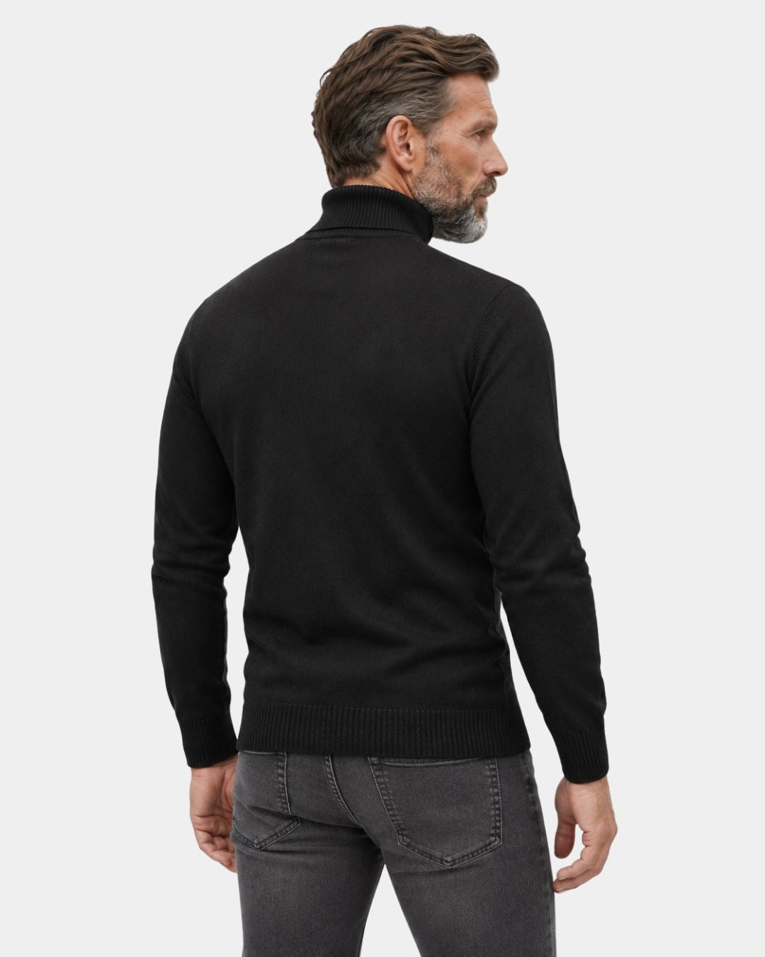 Man wearing a black long-sleeve turtleneck sweater with ribbed cuffs and hem, viewed from the back.
