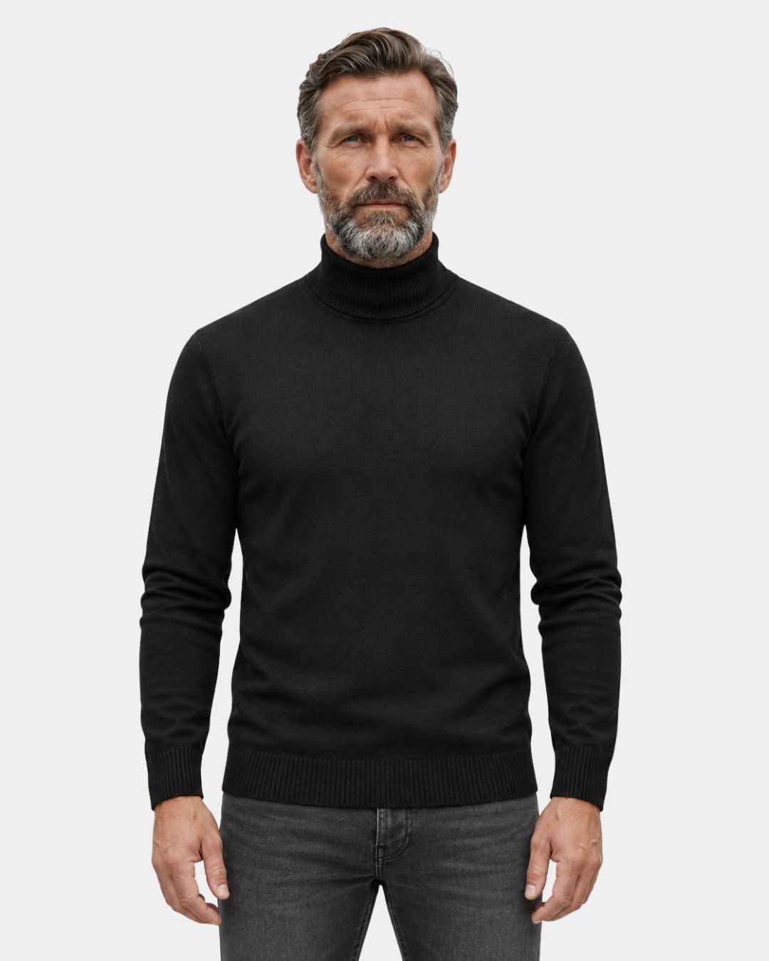 Man wearing a black long-sleeve turtleneck sweater with ribbed collar, cuffs, and hem against a light background.