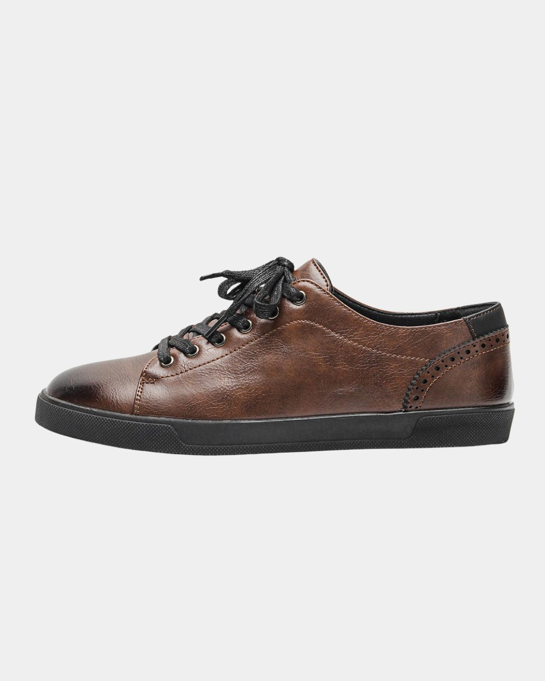 Men’s brown faux leather low top dress sneakers with black laces, brogue heel detailing, and a flat black rubber sole.