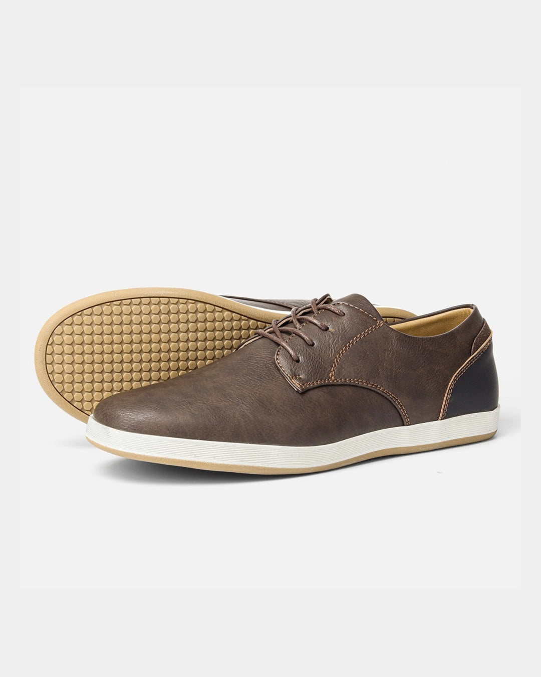 Brown leather lace-up dress sneakers with a white midsole and textured rubber outsole for casual wear.