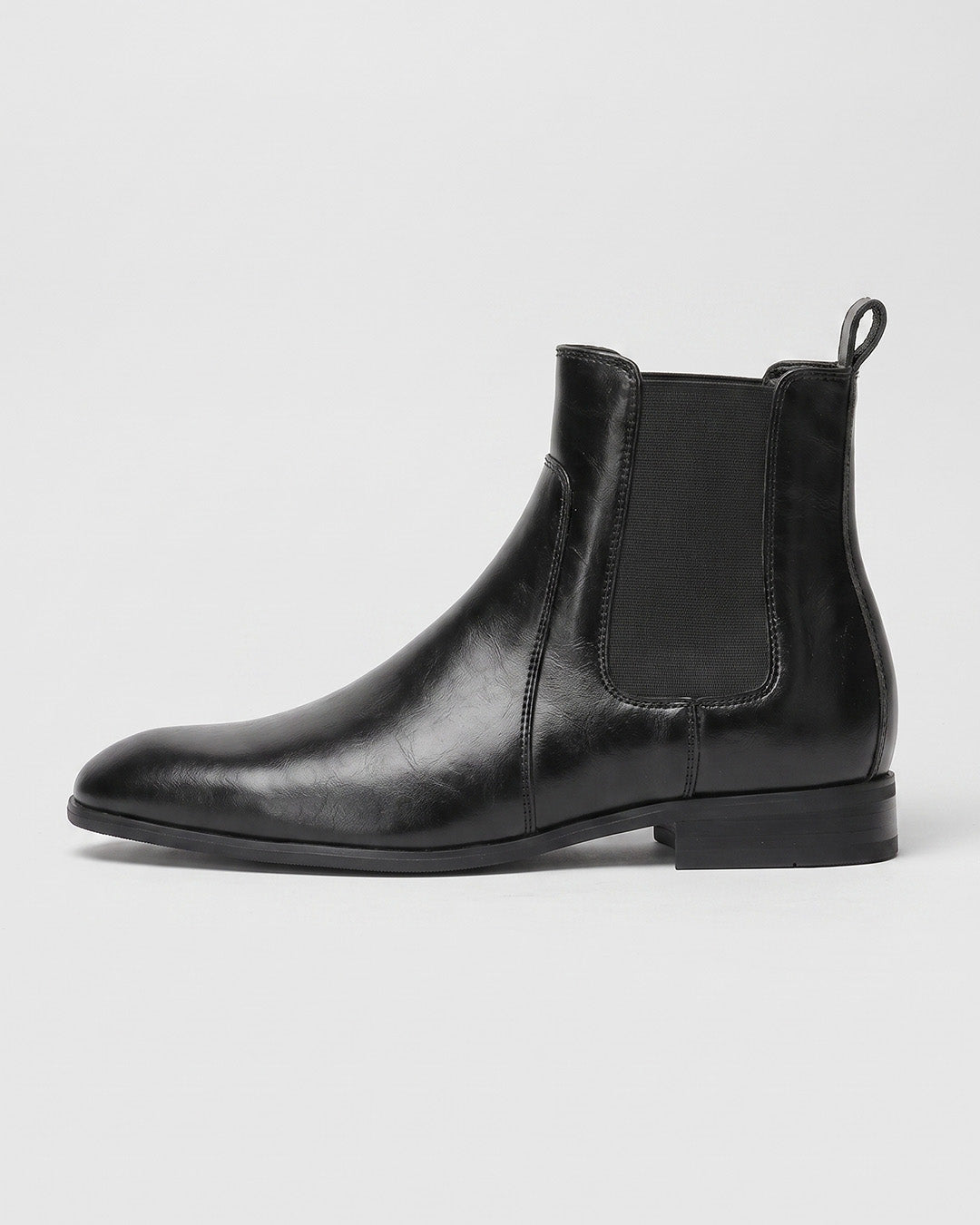 Men’s black Chelsea dress boots with a smooth finish, square-toe silhouette, elastic side panels, and a low-profile heel.