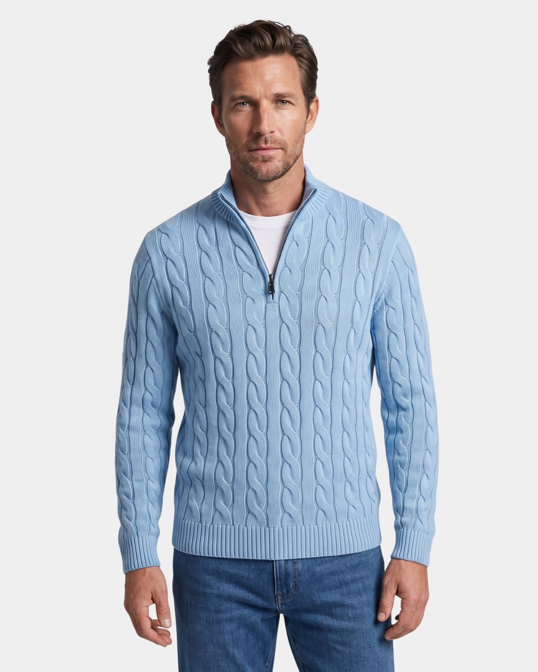 Light blue 100% cotton cable knit quarter-zip sweater with a mock-neck collar and ribbed cuffs on a model.