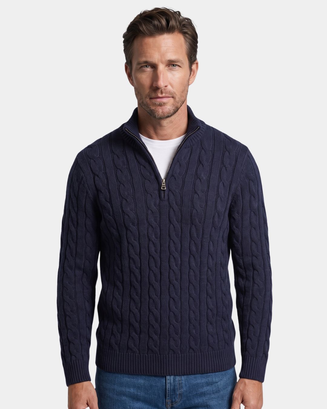 Navy blue cotton cable knit quarter-zip sweater with a mock-neck collar, ribbed cuffs, and hem worn over a white T-shirt.
