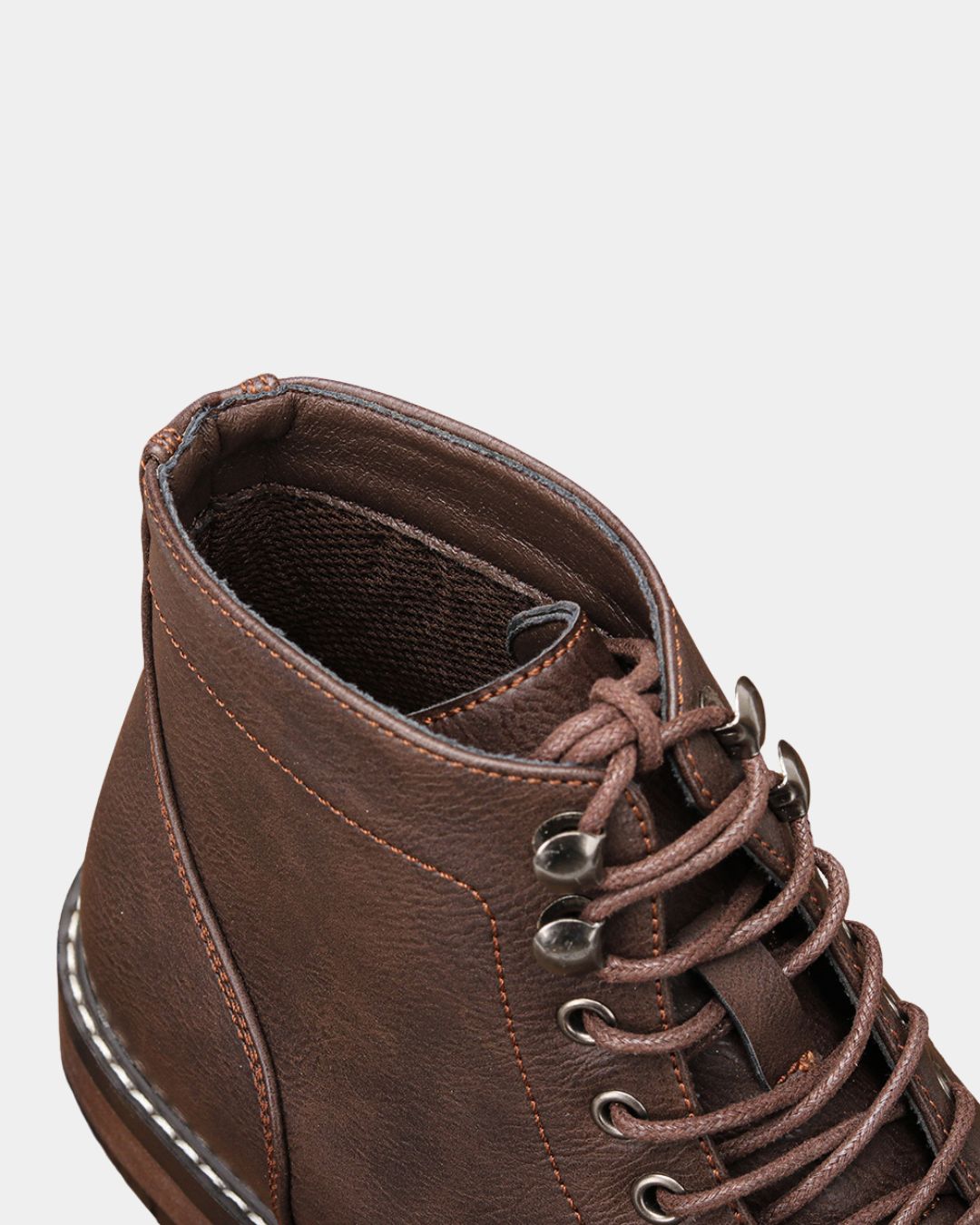 Brown textured lace-up ankle boot with contrast stitching, metal eyelets, speed hooks, and a durable rubber outsole.