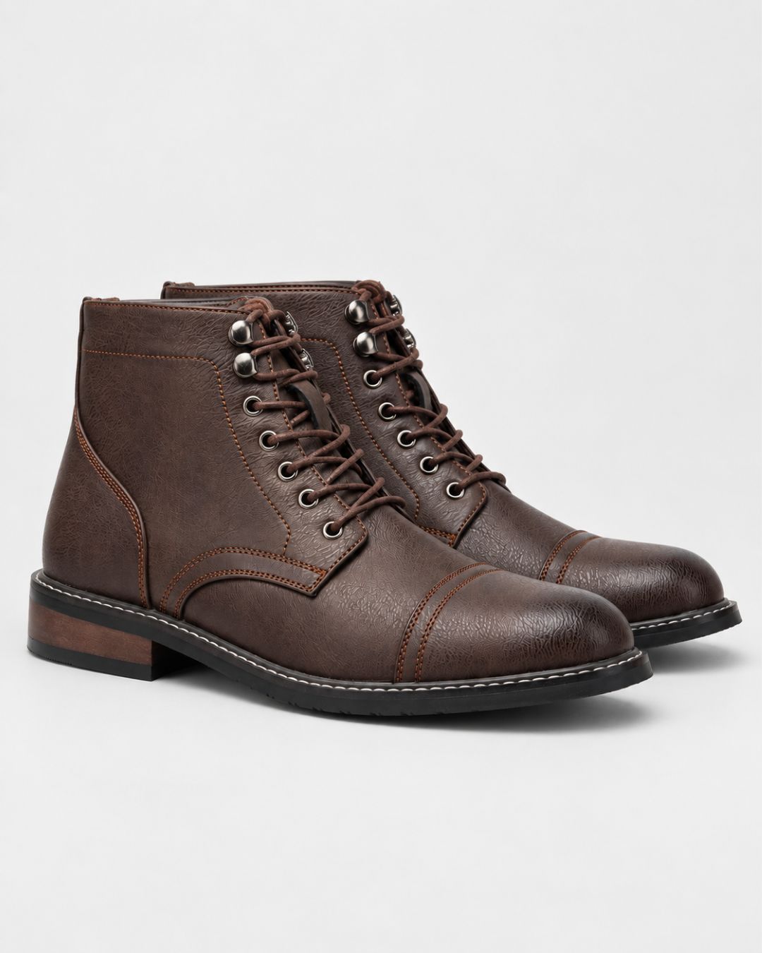 Brown textured cap-toe ankle boots with lace-up front, metal eyelets, contrast stitching, and a durable rubber outsole.