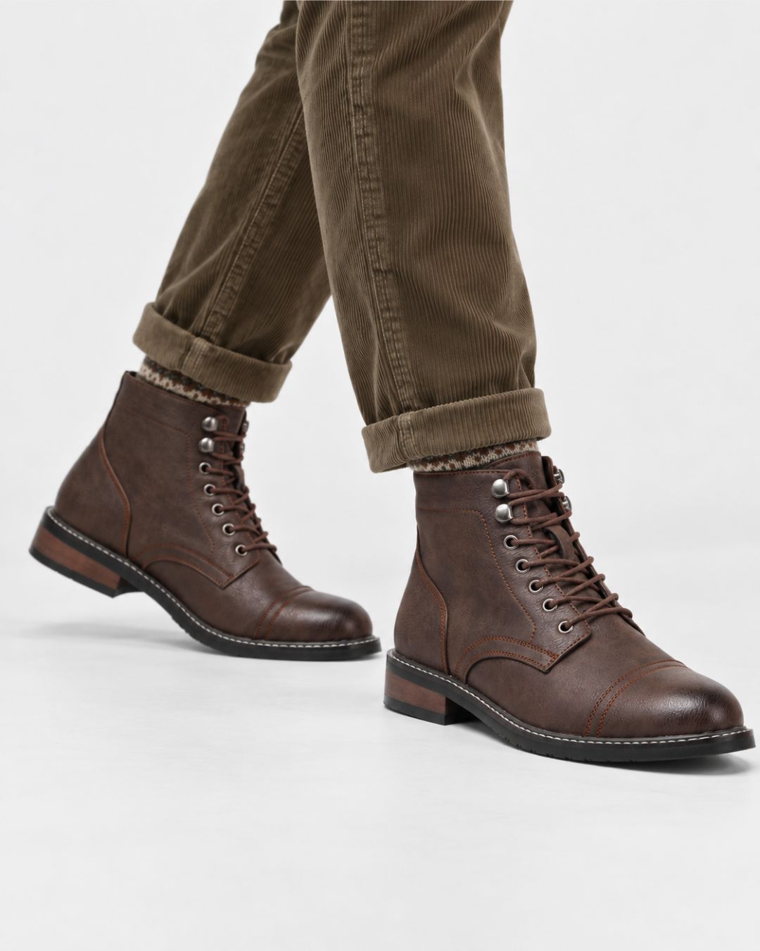 Brown cap-toe lace-up ankle boots with contrast stitching, metal eyelets, and a durable rubber outsole.