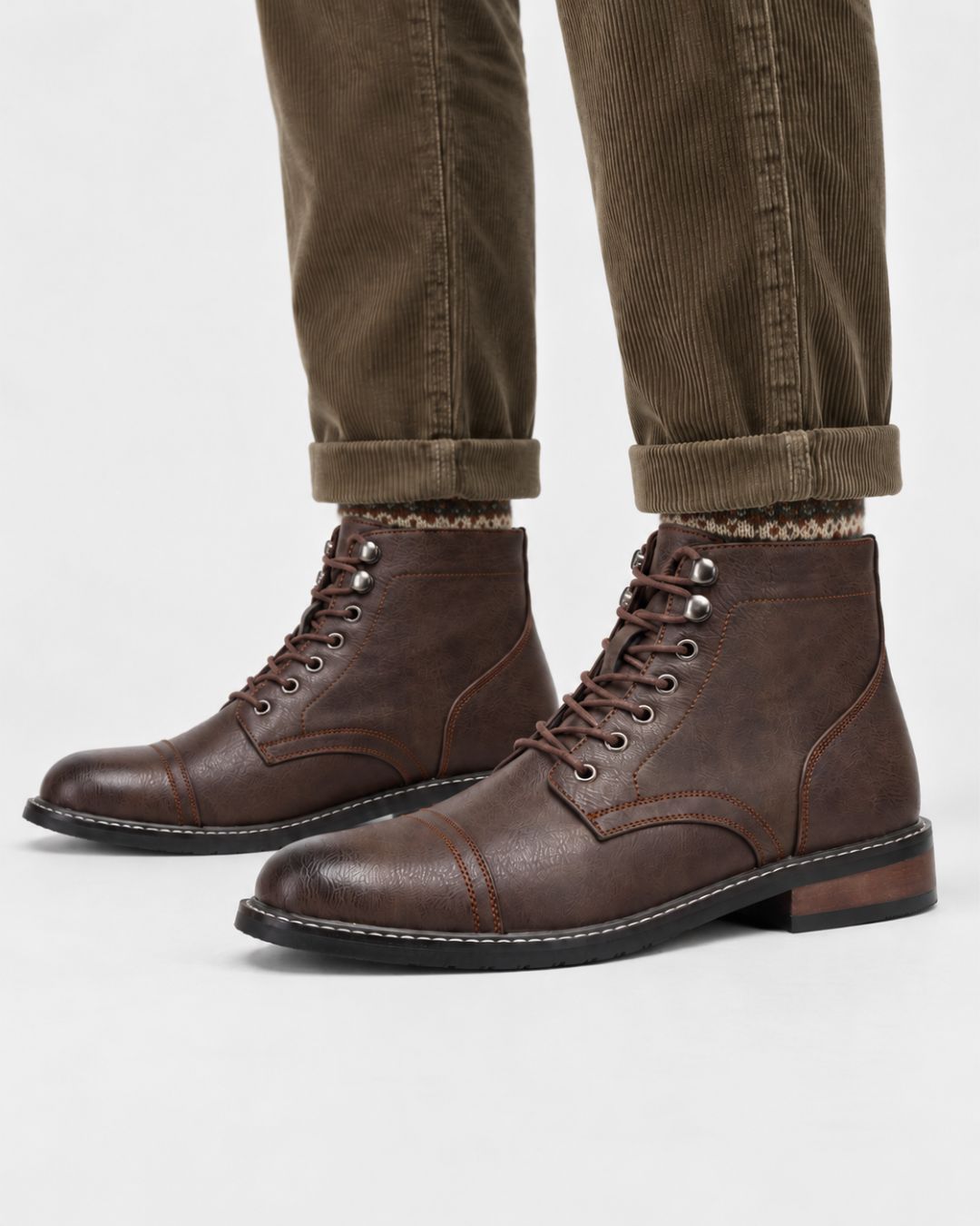 Brown textured cap-toe ankle boots with lace-up front, metal eyelets, and contrast stitching on a durable rubber outsole.