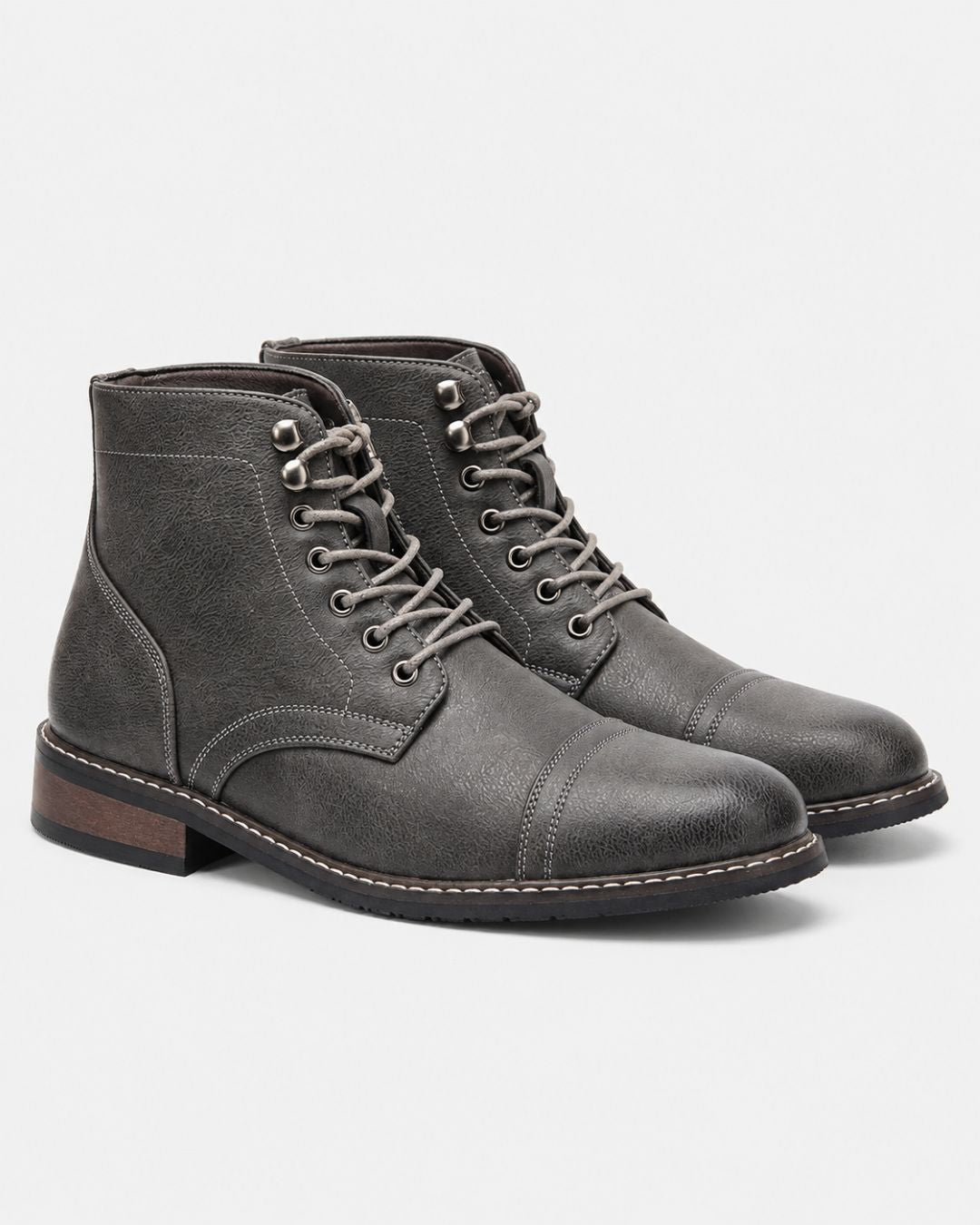 Grey textured cap-toe lace-up ankle boots with contrast stitching, metal eyelets, and a durable rubber outsole.