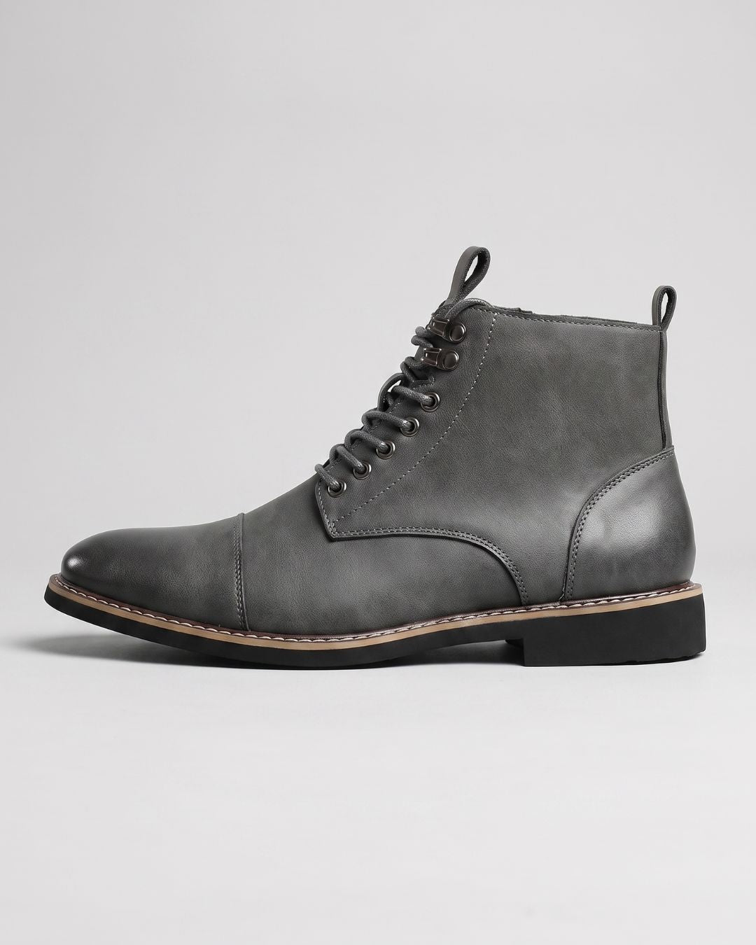Grey men’s cap-toe ankle boots with lace-up front, metal eyelets, and a convenient side zipper on a durable rubber sole.