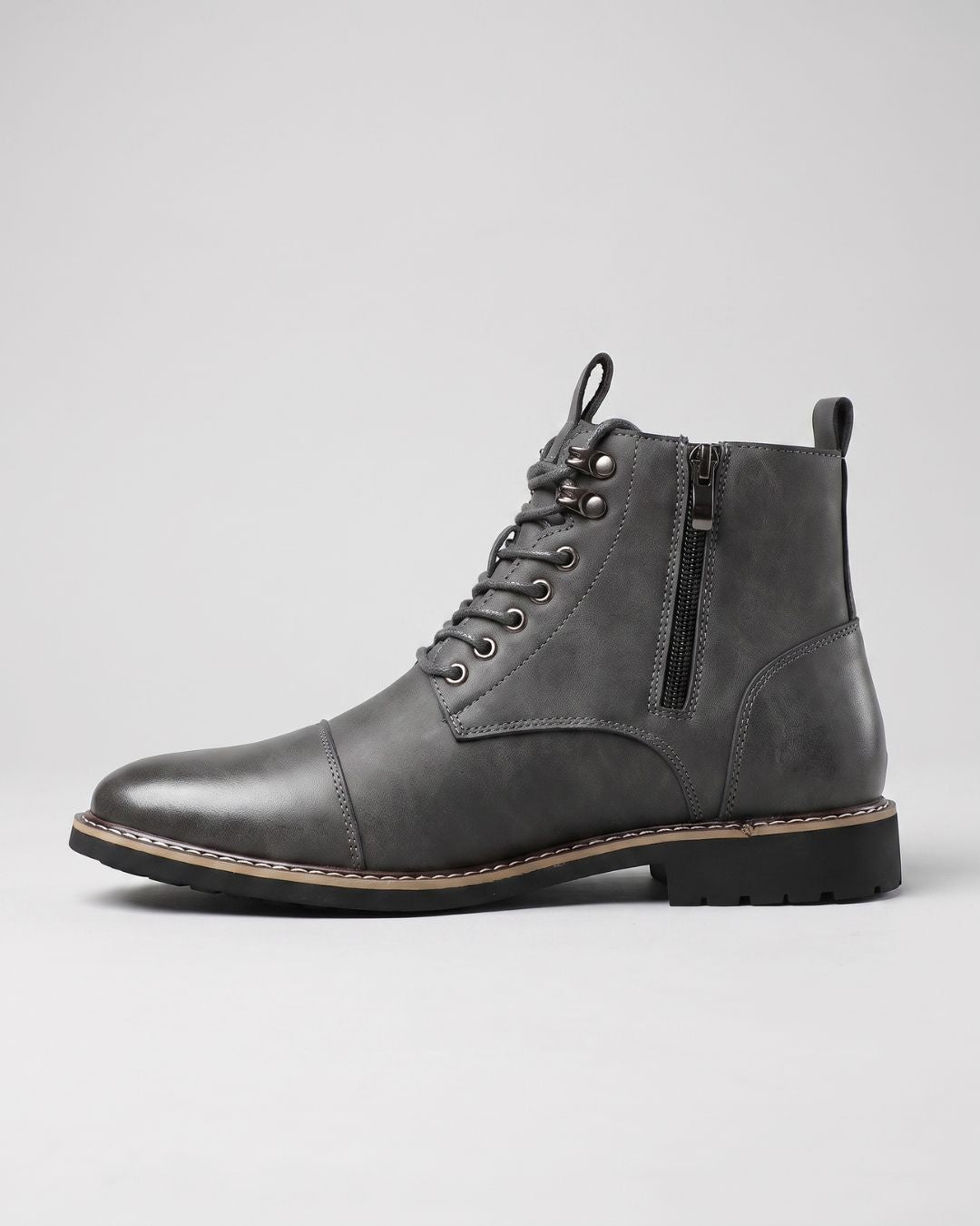 Grey men’s cap-toe ankle boots with side zipper, lace-up front, metal eyelets, and durable rubber outsole.