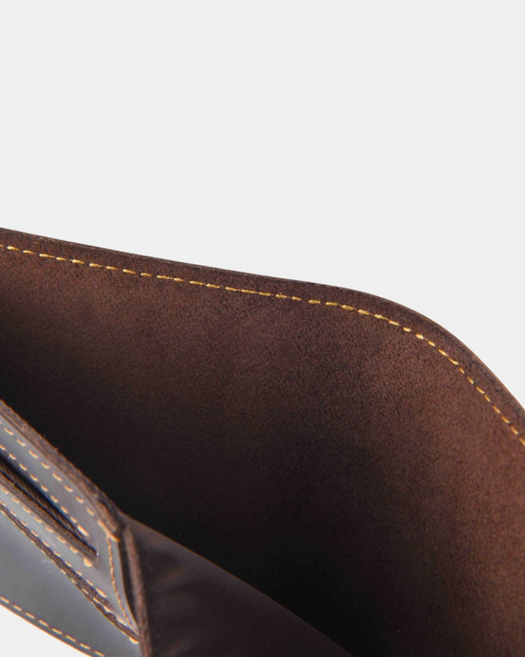 Brown Crazy Horse leather bifold wallet interior with contrast stitching and card slot detail.