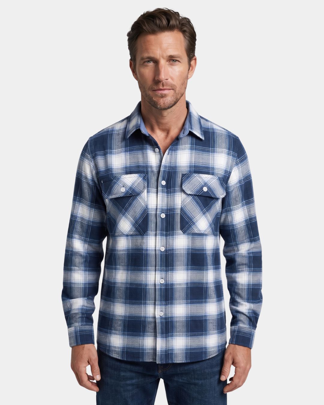 Man wearing a blue and white plaid long-sleeve flannel shirt with a button-front, two chest pockets, and a relaxed fit.