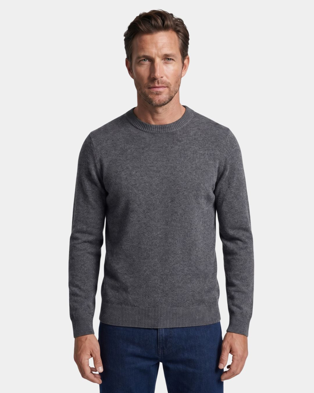 Man wearing a grey 100% wool crew neck sweater with ribbed trim and a clean, regular fit.