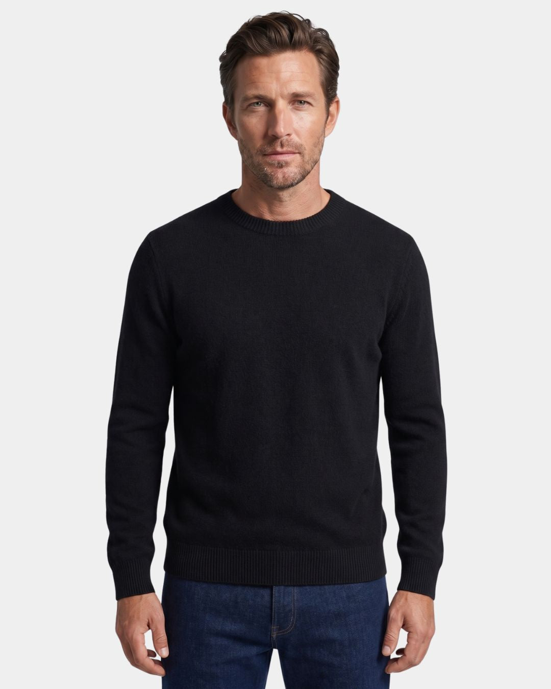 Man wearing a black 100% wool crew neck sweater with ribbed trim and a clean, regular fit.