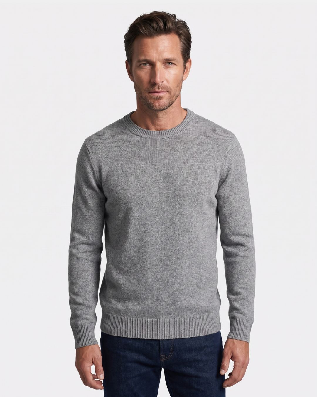 Man wearing a grey 100% wool crew neck sweater with ribbed trim, long sleeves, and a clean, regular fit.