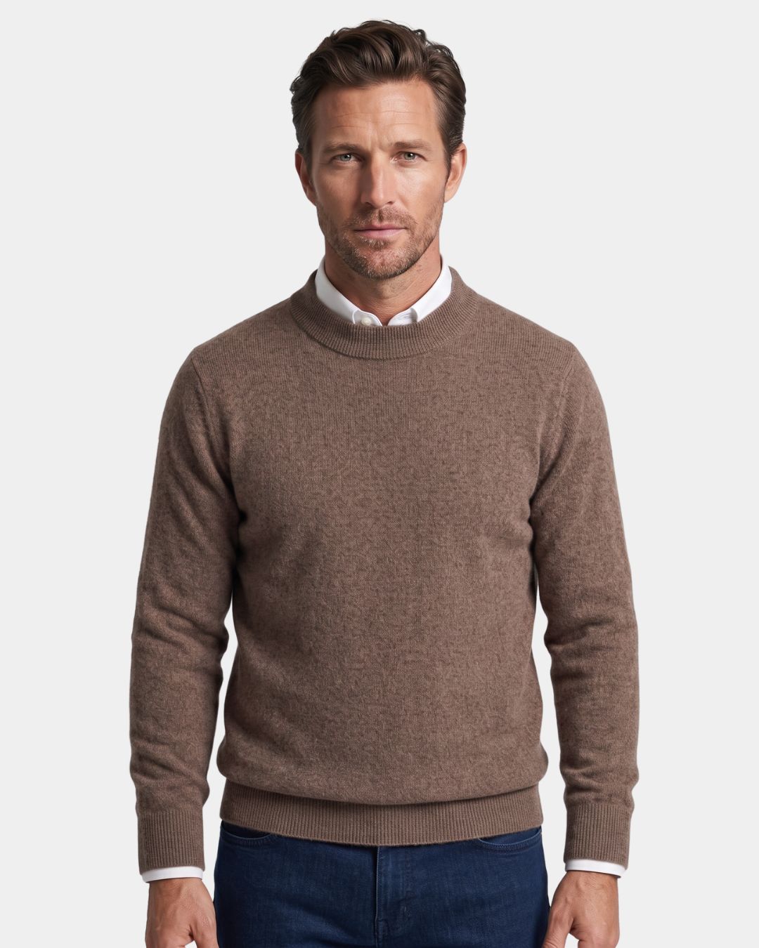Man wearing a brown 100% wool mock neck sweater with ribbed cuffs over a white collared shirt.