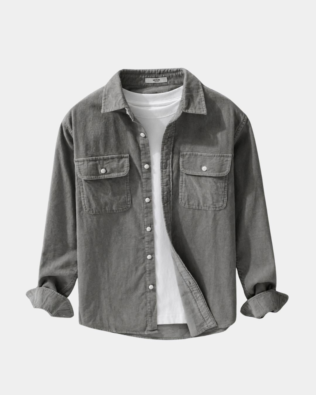Grey cotton corduroy button-up shirt with chest pockets, dropped shoulders, and a white t-shirt underneath.