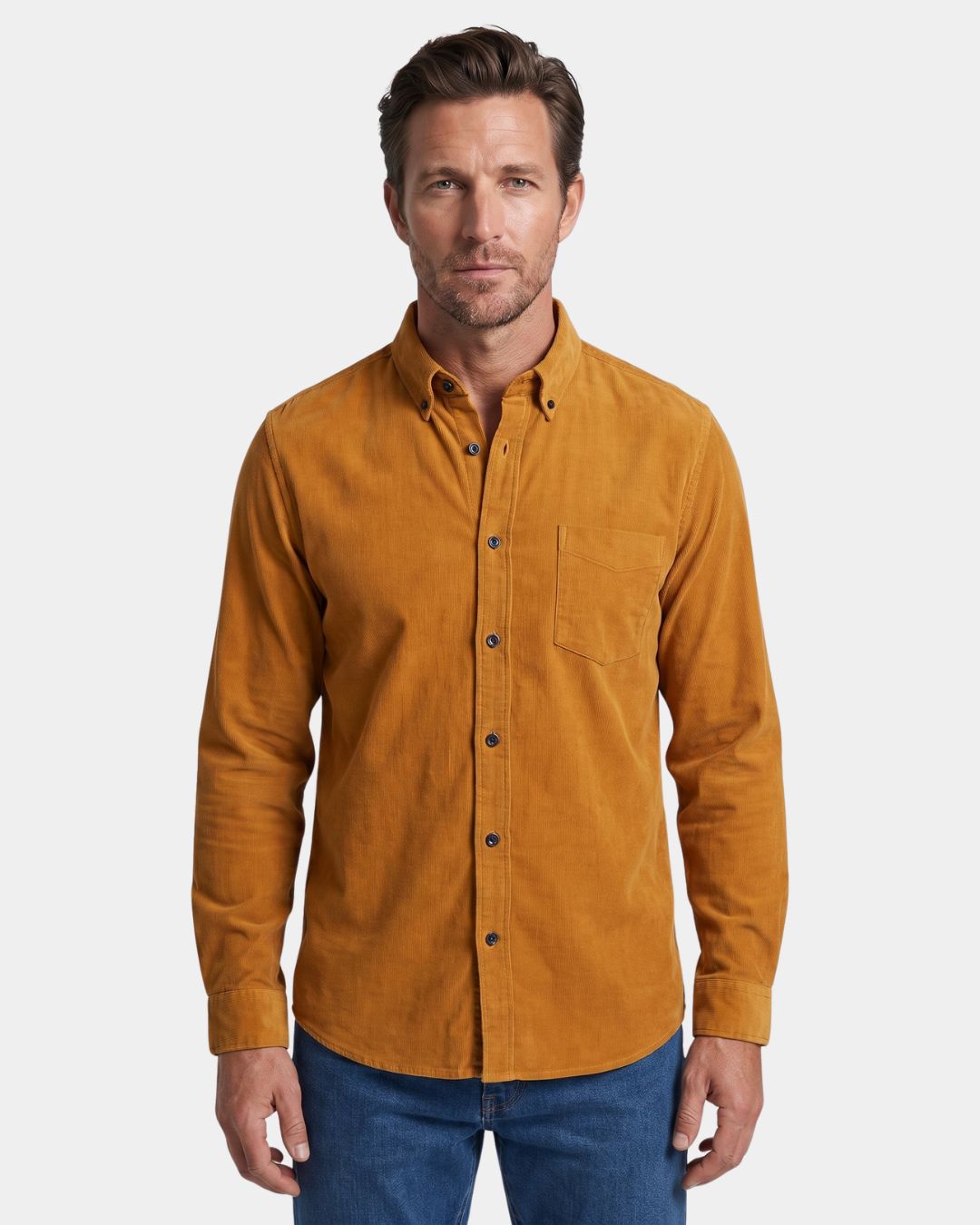 Mustard yellow slim-fit cotton corduroy shirt with a button-down collar and single chest pocket worn by a man.