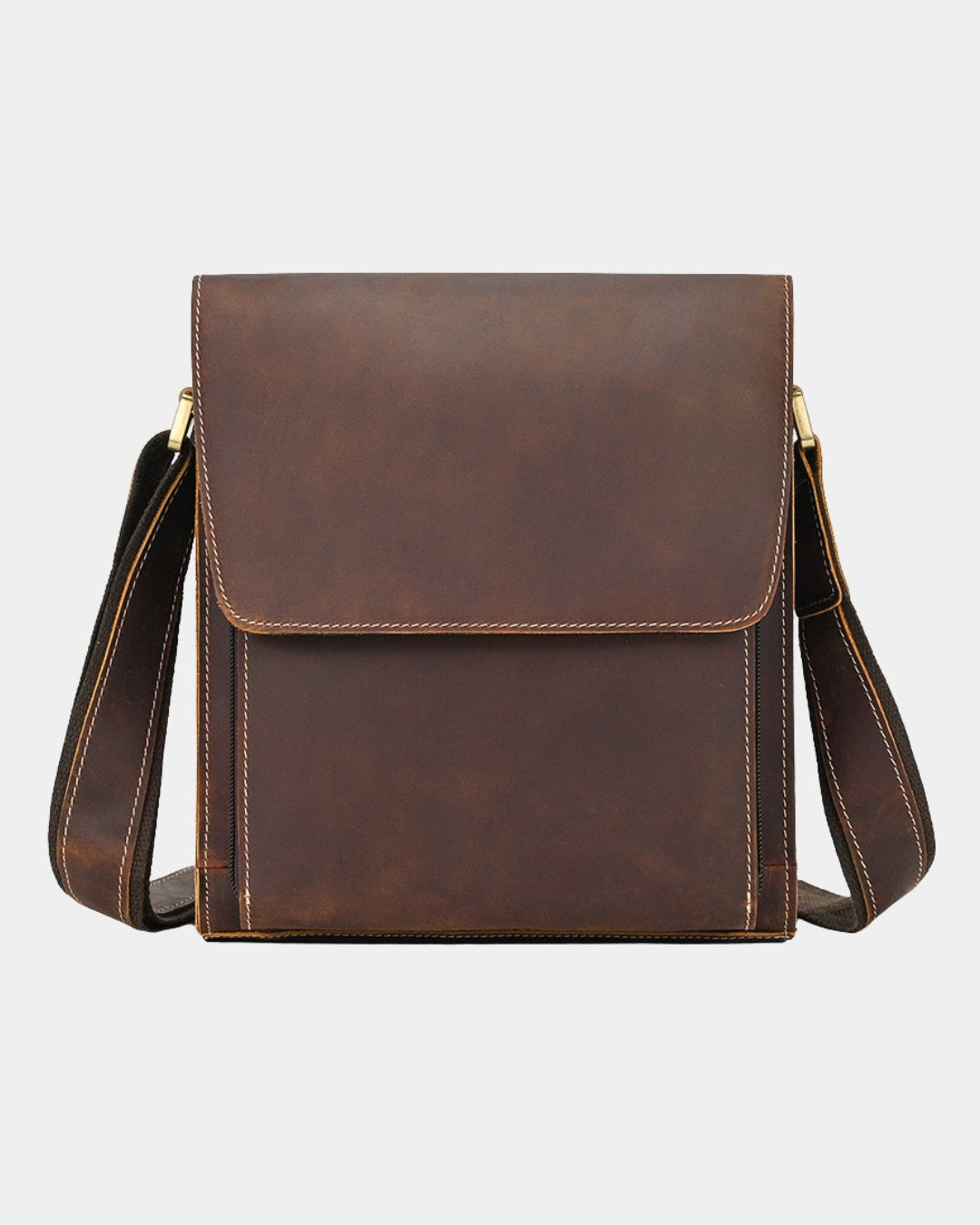 A dark brown leather crossbody bag with a front flap pocket, visible contrast stitching, and a matching leather shoulder strap.